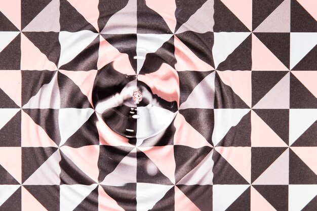 Close-up water rings on abstract poly geometric pool surface