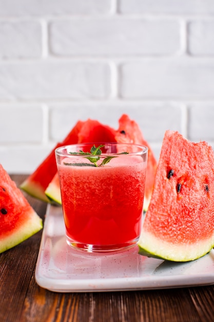 Close-up watermelon juice glass on plate