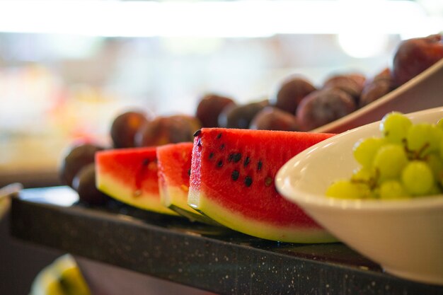 Close-up of watermelon slices and grapes