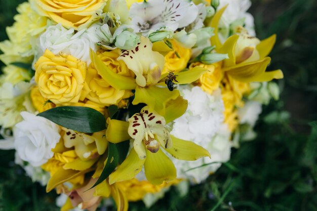Close-up of wedding bouquet with yellow roses