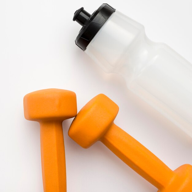 Close-up of weights with water bottle