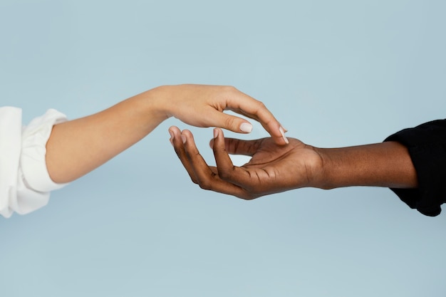 Close-up white and black hand