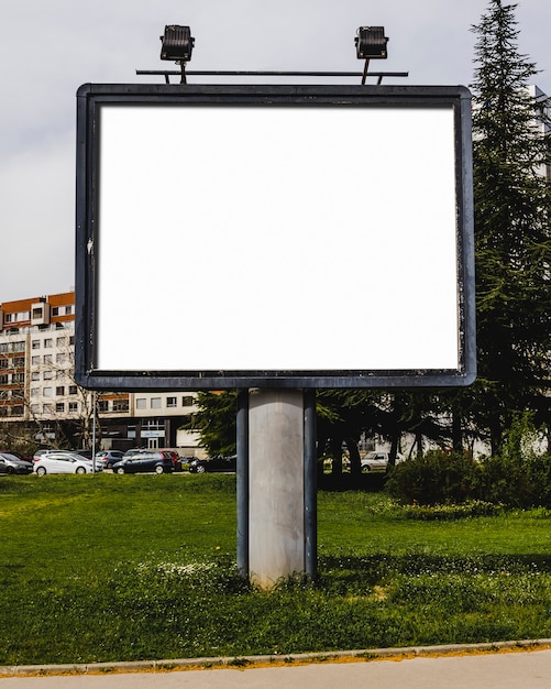 Close-up of white blank billboard with lamp