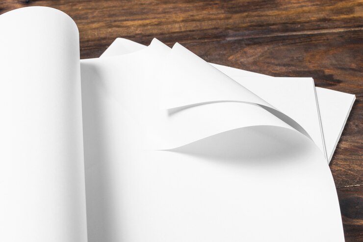 Free Photo close-up of white blank paper over the wooden table