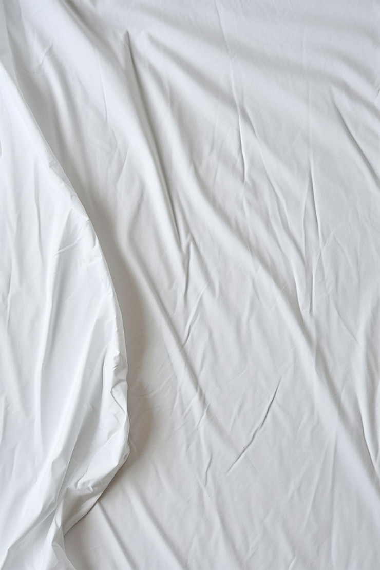 Free Photo close up white cloth background abstract with soft waves