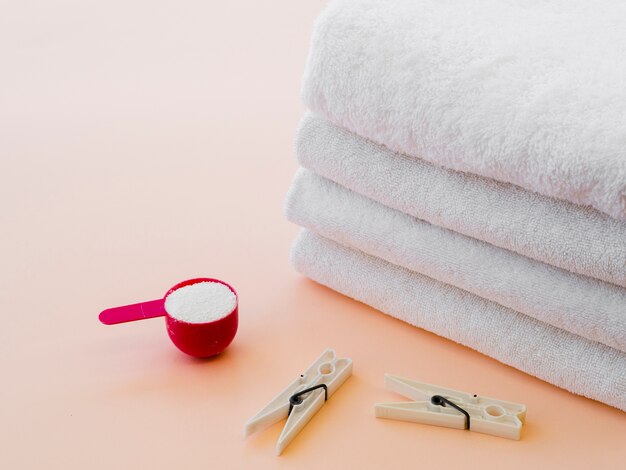 Close-up white folded clean towels with clothes pin