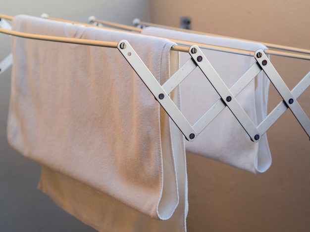 Close-up white towels drying on the line