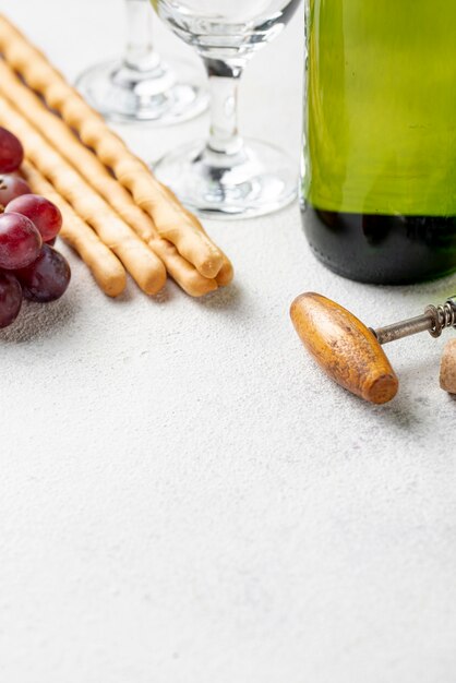 Close-up wine bottle and corkscrew