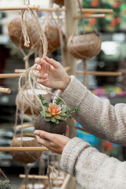 Close-up woman arranging flower market