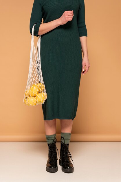 Close up woman in casual clothes carrying reusable turtle bag