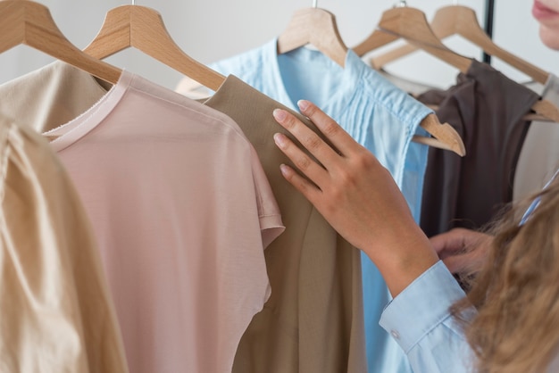 Free photo close-up woman checking new clothes