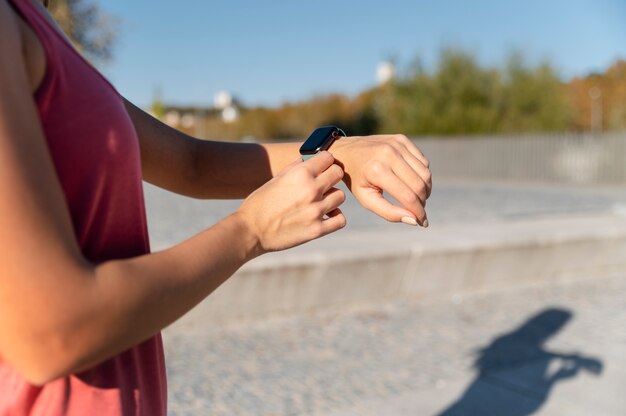 Close up woman checking watch