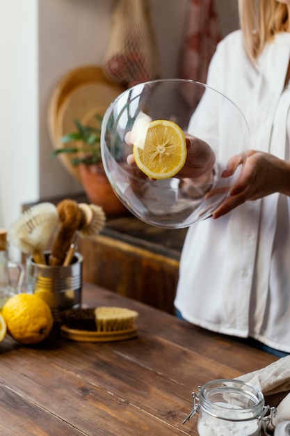 Free photo close up woman cleaning bowl