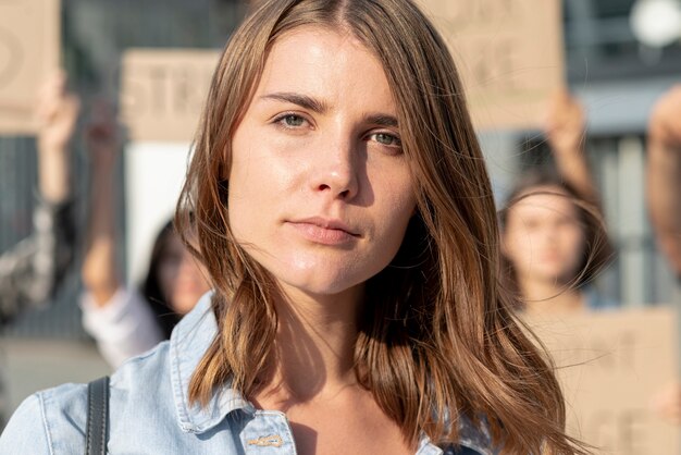 Close-up woman demonstrating for peace