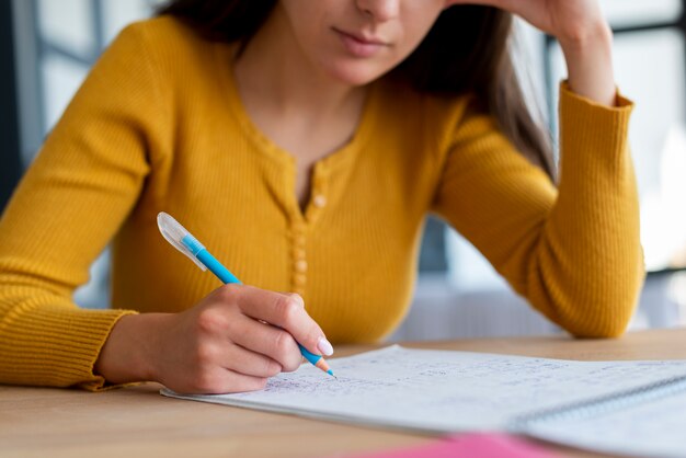 Close-up of woman doing her work