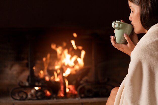 Close up woman drinking hot tea