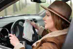 Free photo close up woman driving car