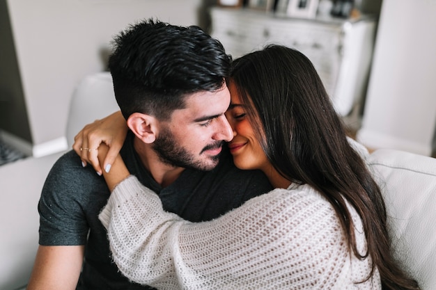 Close-up of woman embracing her boyfriend