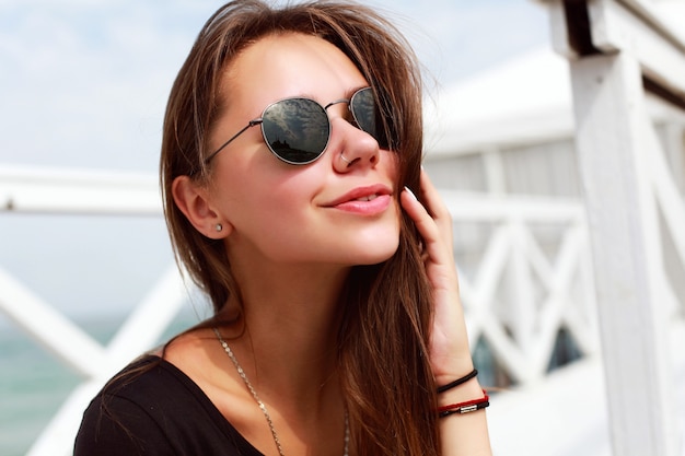 Close-up of woman enjoying a sunny day on the pier