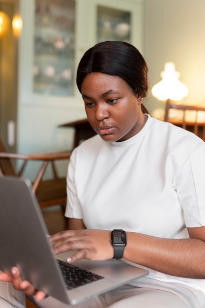 Close up on woman exercising after online instructor