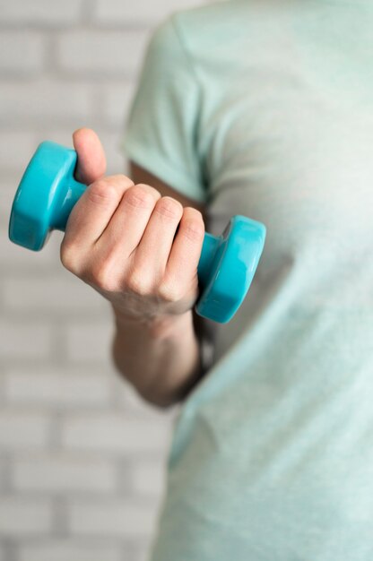 Close-up woman exercising at home