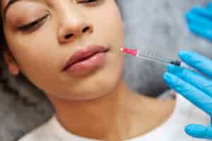 Free photo close up woman getting hyaluronic acid injection