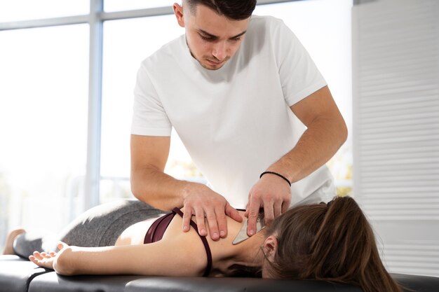 Free photo close up woman getting neck massage