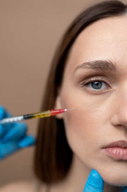 Free photo close up woman getting prp injection