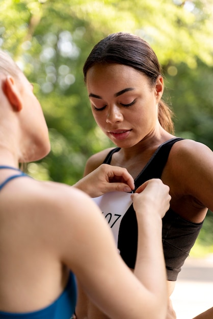 Close up woman helping competitor