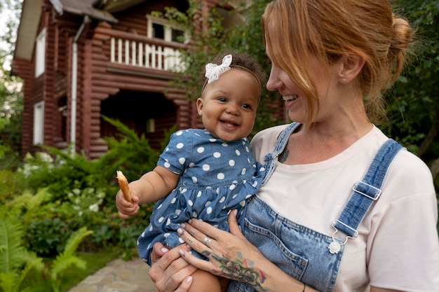 close up woman holding baby