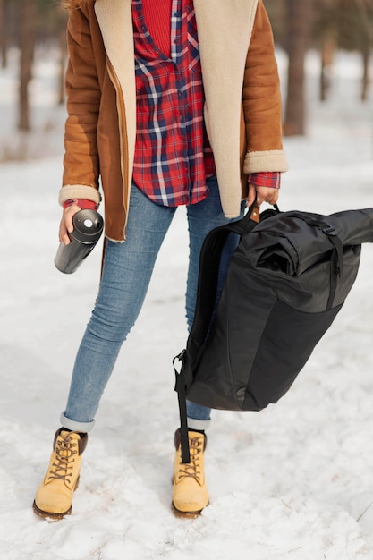 Free photo close-up woman holding backpack