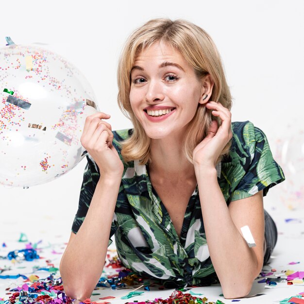 Close-up woman holding a balloon