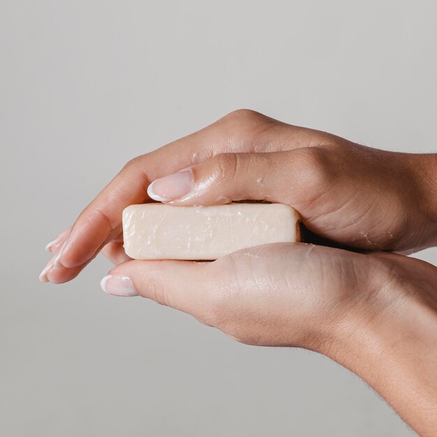 Close-up woman holding block of soap