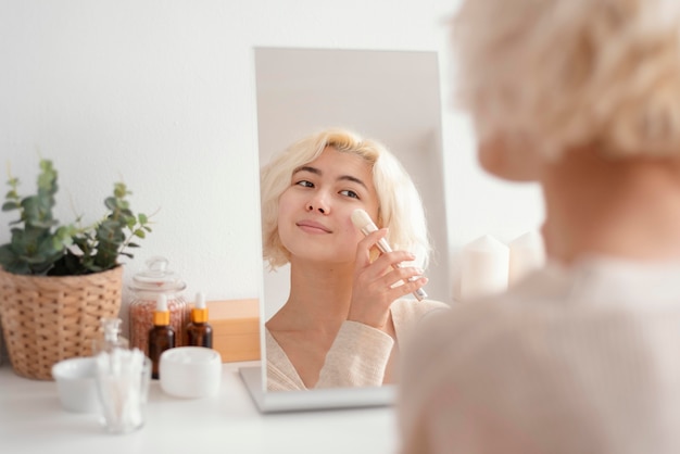 Free photo close up woman holding brush