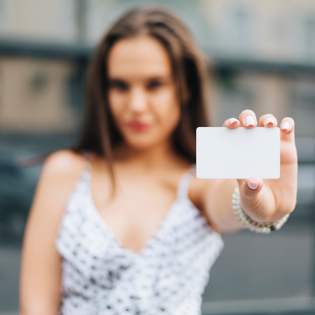 Close-up woman holding a card mock-up