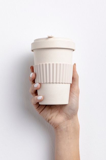 Close-up woman holding a coffee cup