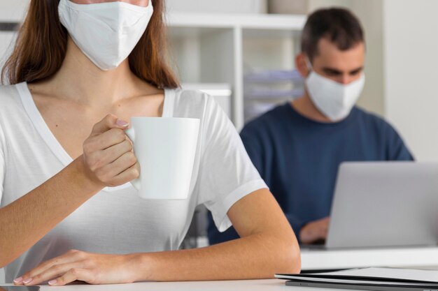 Close-up woman holding coffee cup