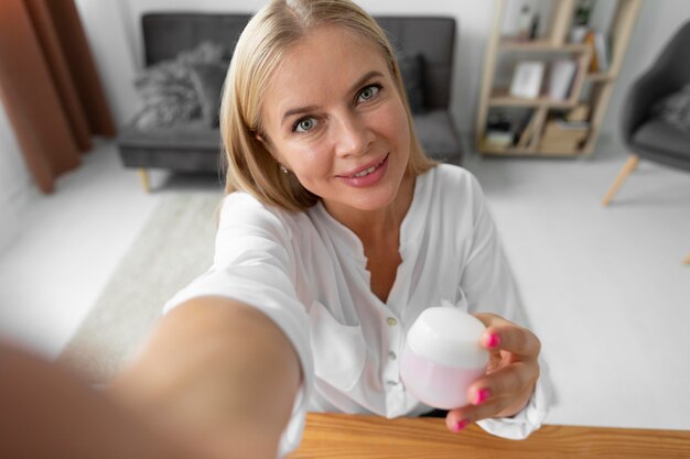 Close up woman holding container