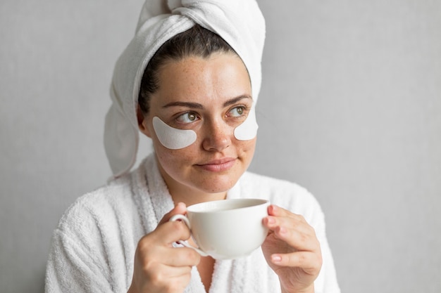 Close-up woman holding cup