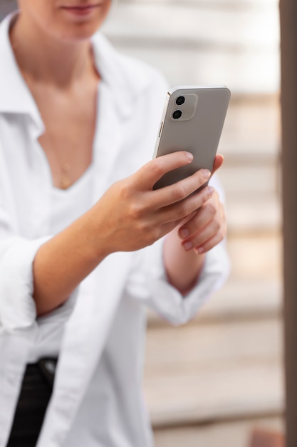 close up woman holding device