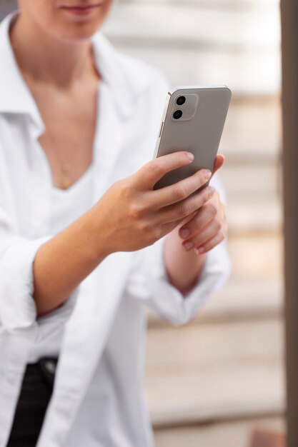 Close up woman holding device