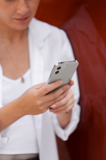 Close up woman holding device