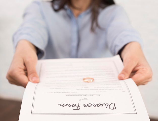 Free photo close-up woman holding divorce form