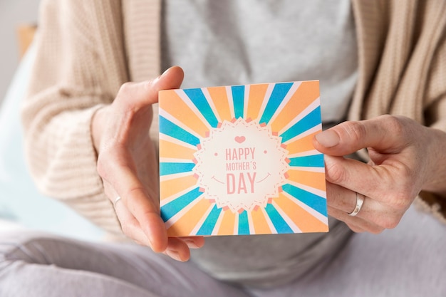 Close-up woman holding greeting card