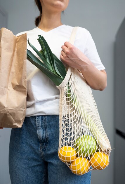 Close up woman holding groceries