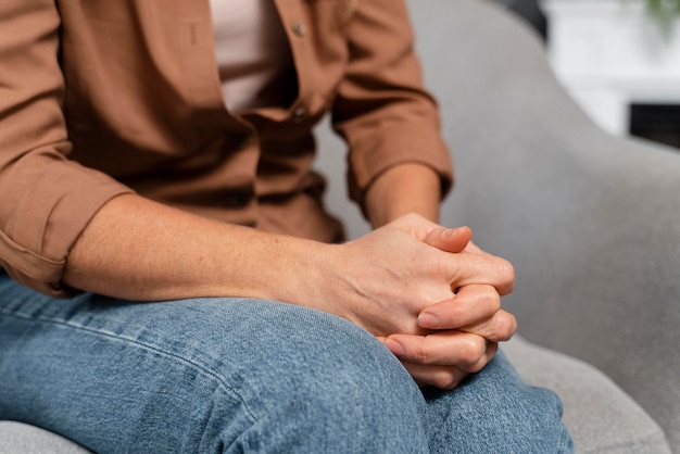 close-up woman holding hands together
