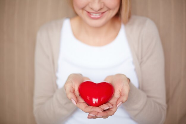 Close-up of woman holding a heart