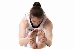 Free photo close-up of woman holding her feet