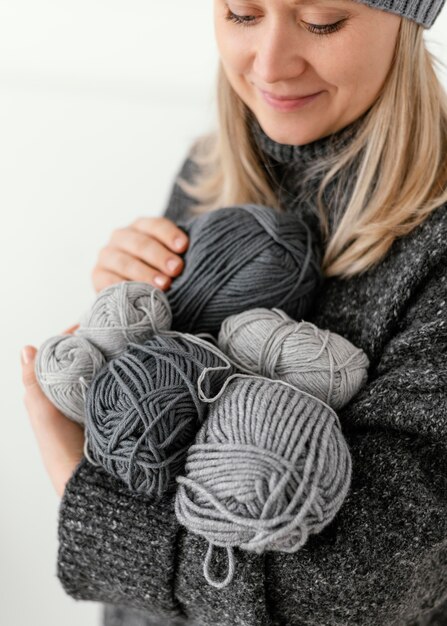 Close-up woman holding knitting yarns