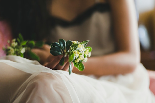 Close-up woman holding lowers